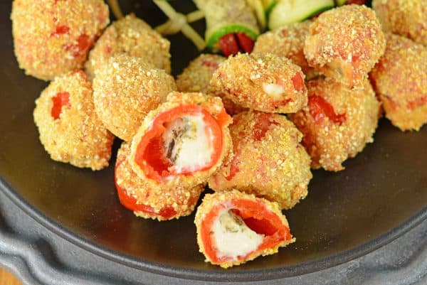 peppadew-poppers-6 Sweet peppadew peppers stuffed with tangy goat cheese, tossed in cornmeal and then lightly fried. Dip in a chipotle aioli, green goddess or honey mustard sauce.