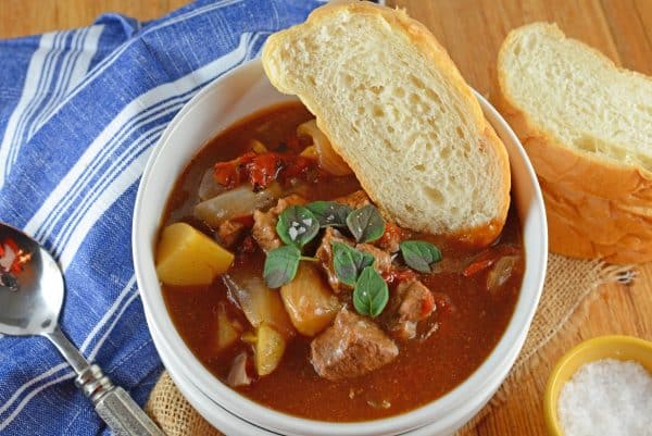 slow-cooker-beef-stew-3 Beef Stew is one of the most iconic comfort foods and this version features tender beef, onions, potatoes, fire roasted tomatoes in a rich herb filled stew. This recipe can be made in the slow cooker or Dutch oven.