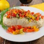 Healthy Baked Halibut is an easy, healthy and colorful dish. Perfect for an easy weeknight meal or sophsiticated enough for a holiday. #bakedhalibutrecipes #healthybakedhalibut www.savoryexperiments.com