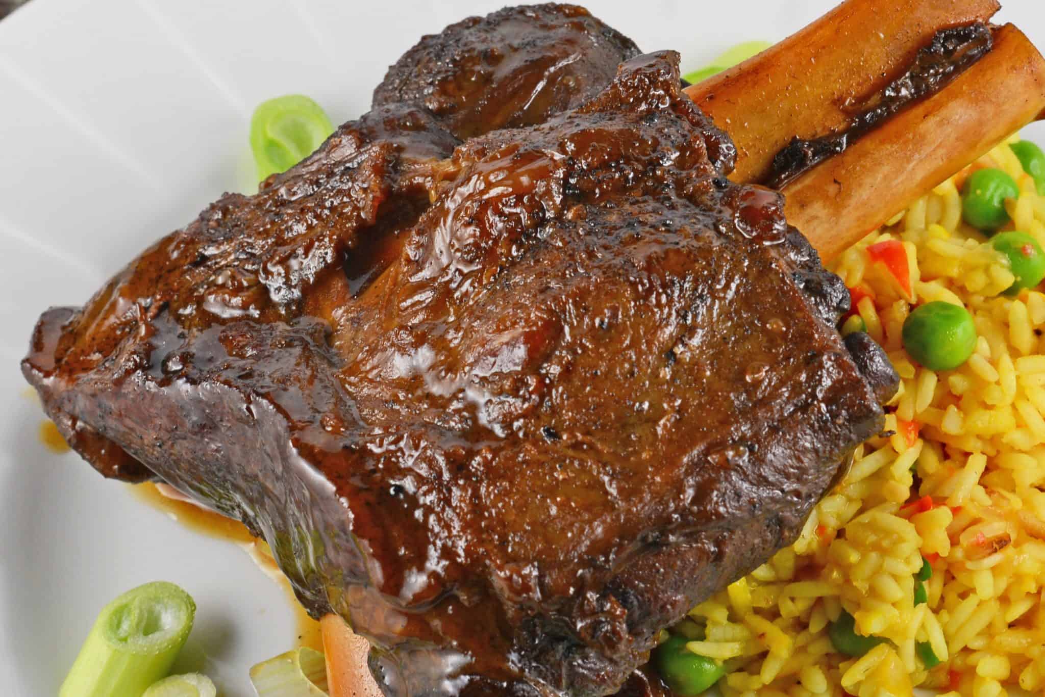 Braised Wild Boar Shanks are a sophisticated and exotic meal, ideal for special occasions and dinner parties. Lean and healthy with loads of rich flavor. #wildboar #braisedwildboar www.savoryexperiments.com