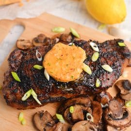 pat of cowboy butter on top of a steak