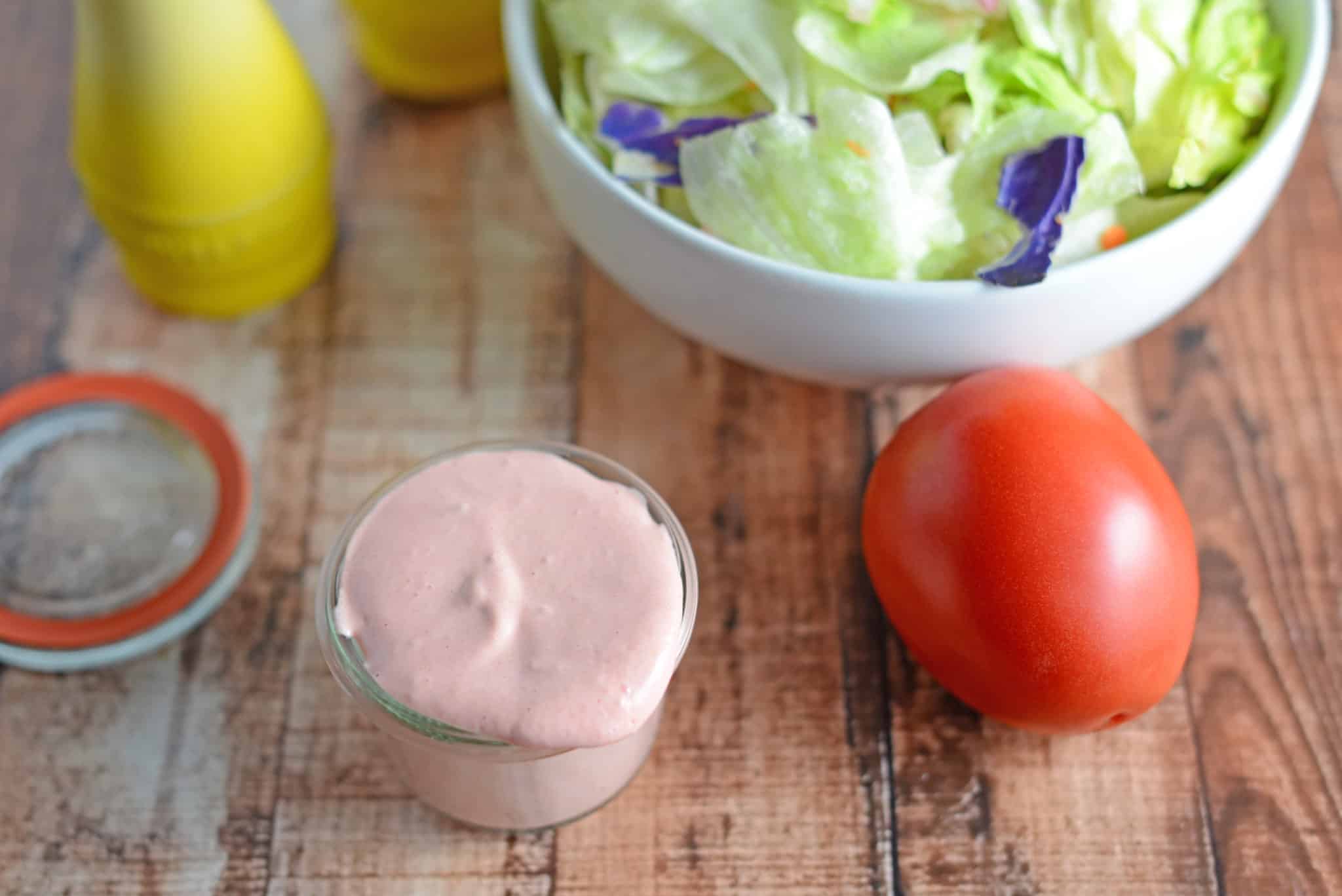 Creamy Tomato Salad Dressing Recipe - this homemade salad dressing can also be used to baste veggies on the grill or as a dipping sauce for a veggie tray. Uses fresh tomatoes with zesty lemon juice and Dijon mustard. www.savoryexperiments.com