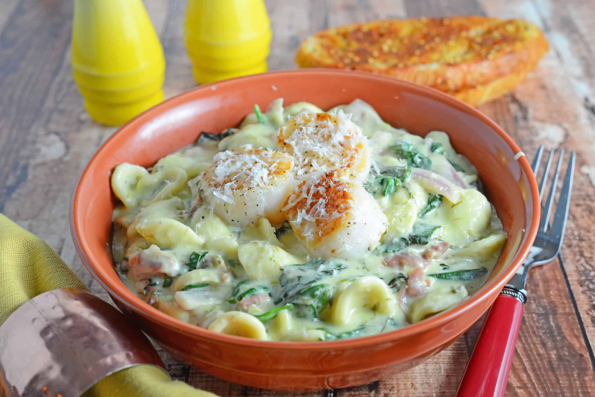 Scallion Pesto Scallop Pasta is a restaurant quality dish, creamy pasta sauce with garlic, Swiss chard, prosciutto and seared scallops. #pastarecipes #scalloprecipes www.savoryexperiments.com