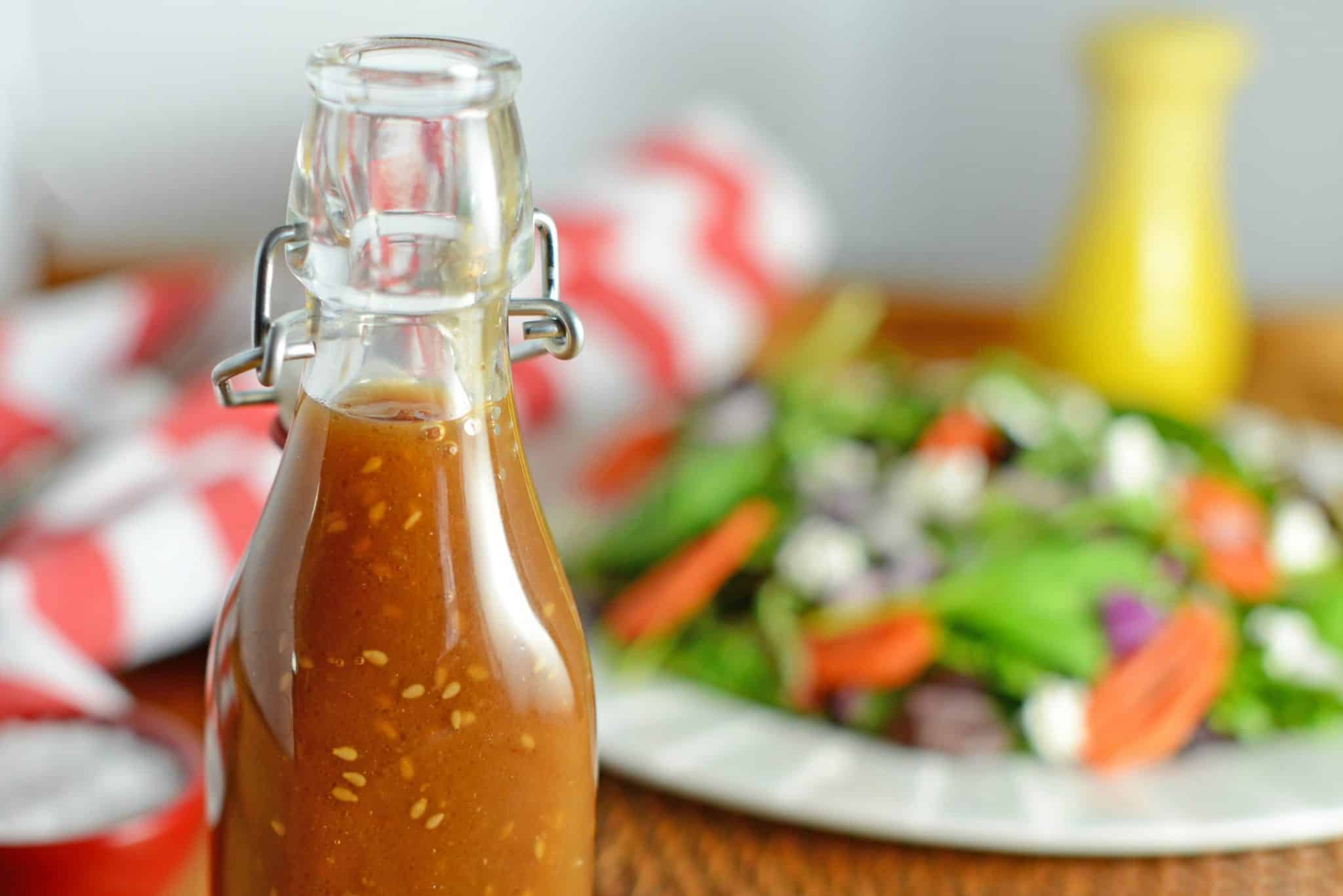This Asian Salad Dressing is a great copycat recipe for what you get at Japanese steakhouses like Benihana or Kobe! It's a sweet ginger and sesame combination! #asiansaladdressing #gingersaladdressing #japanesesaladdressing www.savoryexperiments.com