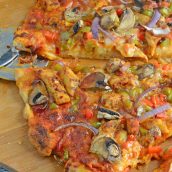 Caribbean Jerk Chicken Pizza is an easy homemade pizza recipe using spicy chicken, fresh vegetables and a touch of honey. #homemadepizza #jerkchicken #jerkchickenpizza www.savoryexperiments.com