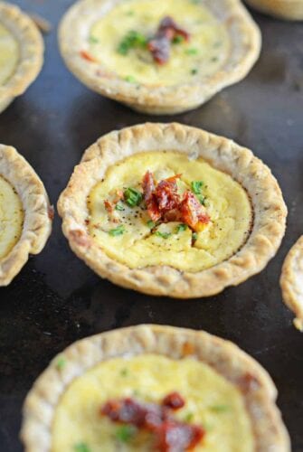 Make easy and delicious individual goat cheese quiche! Eggs whipped with goat cheese, sun dried tomatoes, pine nuts and Parmesan cheese, these are perfect for brunch, an appetizer or entree.