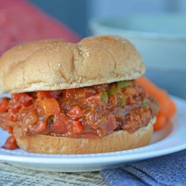 This semi-homemade Pulled Pork Sandwich is a quick and easy kid friendly option! It's an easy pulled pork recipe that will be ready in just 15 minutes! #pulledporksandwich #semihomemade #easypulledporkrecipe www.savoryexperiments.com