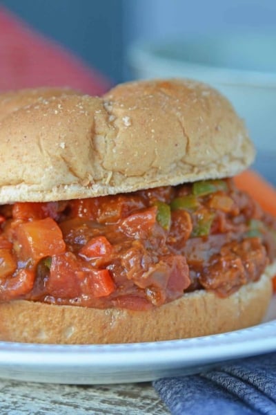 This semi-homemade Pulled Pork Sandwich is a quick and easy kid friendly option! It's an easy pulled pork recipe that will be ready in just 15 minutes! #pulledporksandwich #semihomemade #easypulledporkrecipe www.savoryexperiments.com