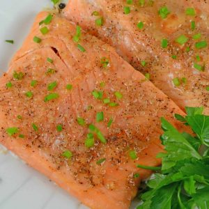 Apple Roasted Salmon is one of my favorite healthy and quick dinners. This recipe is perfect for busy families who need a tasty dinner fast! #bakedsalmon #easysalmonrecipes www.savoryexperiments.com
