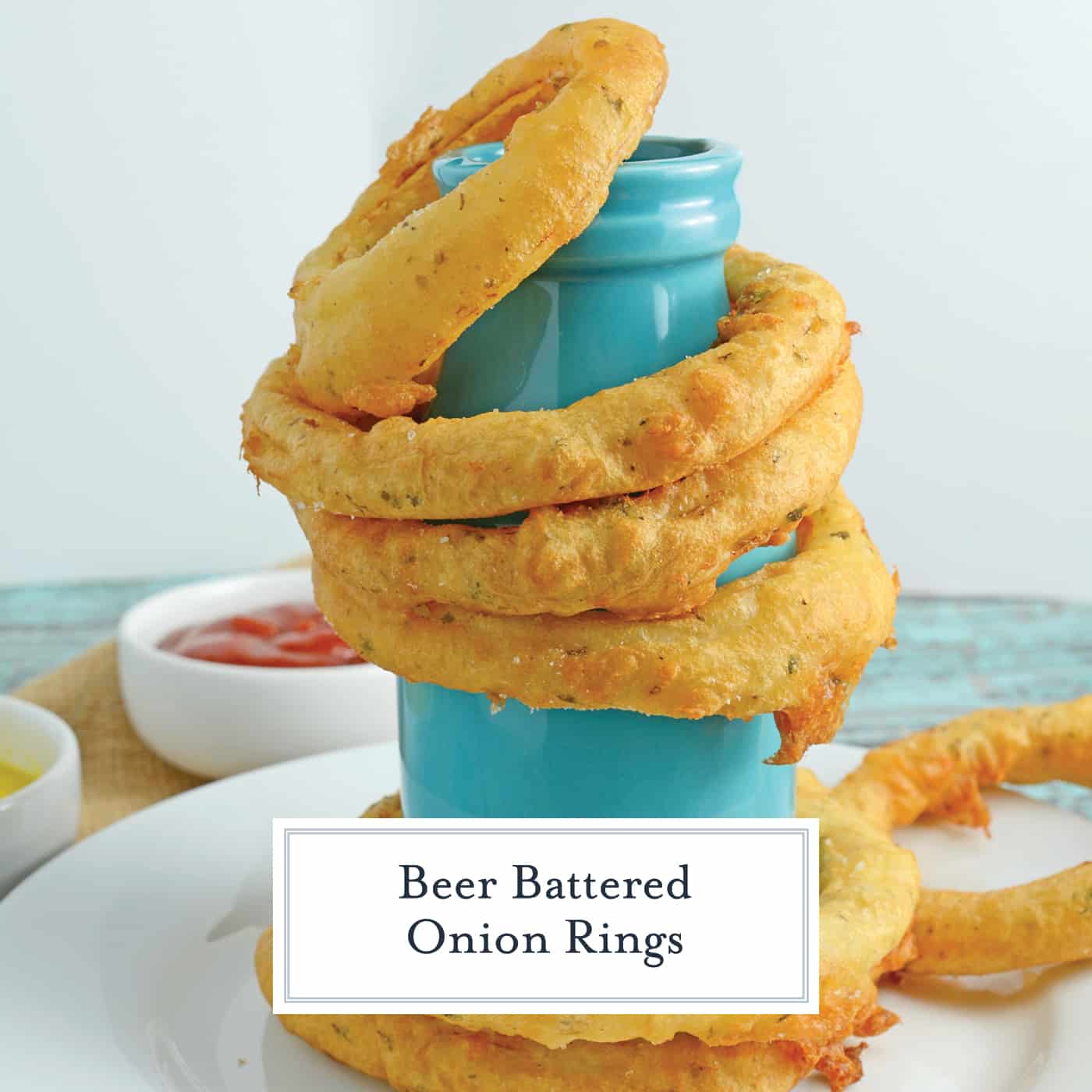 Beer Battered Onion Rings gives you crunchy and crispy homemade beer battered onion rings. Dip them in a spicy chipotle remoulade or enjoy them alone. #homemadeonionrings #friedonionrings #beerbatteredonionrings www.savoryexperiments.com