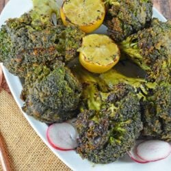 Garlic Grilled Broccoli is an excellent side dish for grilled meals. Marinate in a garlic and spice mix and then char on the grill for great flavor!