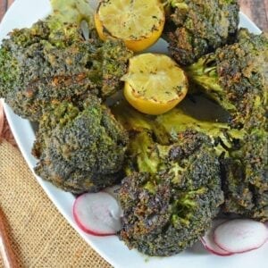 Garlic Grilled Broccoli is an excellent side dish for grilled meals. Marinate in a garlic and spice mix and then char on the grill for great flavor!