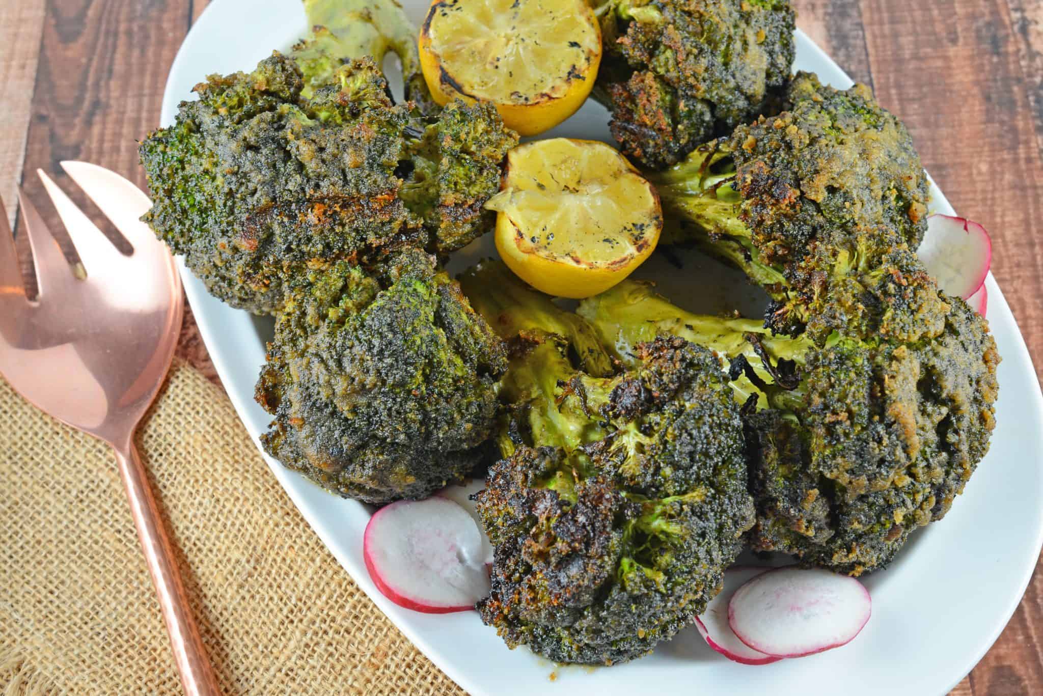 Garlic Grilled Broccoli is an excellent side dish for grilled meals. Marinate in a garlic and spice mix and then char on the grill for great flavor!