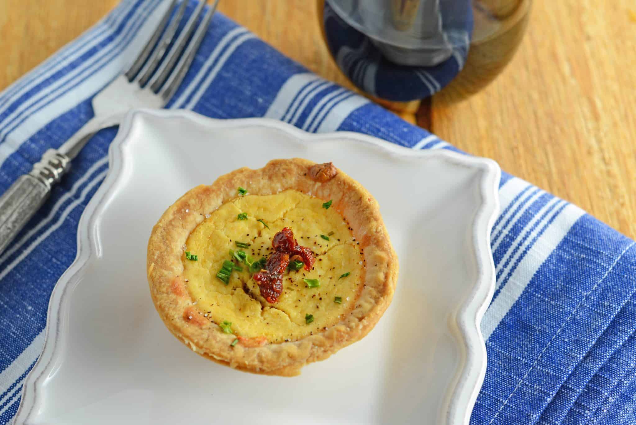 Make easy and delicious individual goat cheese quiche! Eggs whipped with goat cheese, sun dried tomatoes, pine nuts and Parmesan cheese, these are perfect for brunch, an appetizer or entree.