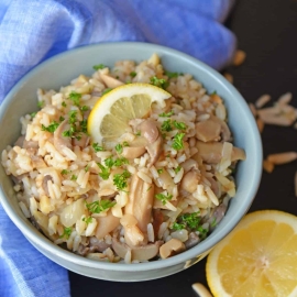 Almond Rice Pilaf is an easy side dish made with crunchy almonds, mushrooms and savory chicken broth and lemon juice to give it loads of flavor! An easy rice recipe the whole family will love. #ricepilafrecipe #easysidedish www.savoryexperiments.com