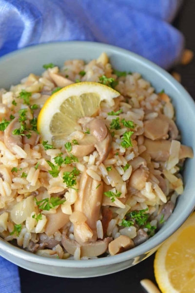 Almond Rice Pilaf is an easy side dish made with crunchy almonds, mushrooms and savory chicken broth and lemon juice to give it loads of flavor! An easy rice recipe the whole family will love. #ricepilafrecipe #easysidedish www.savoryexperiments.com