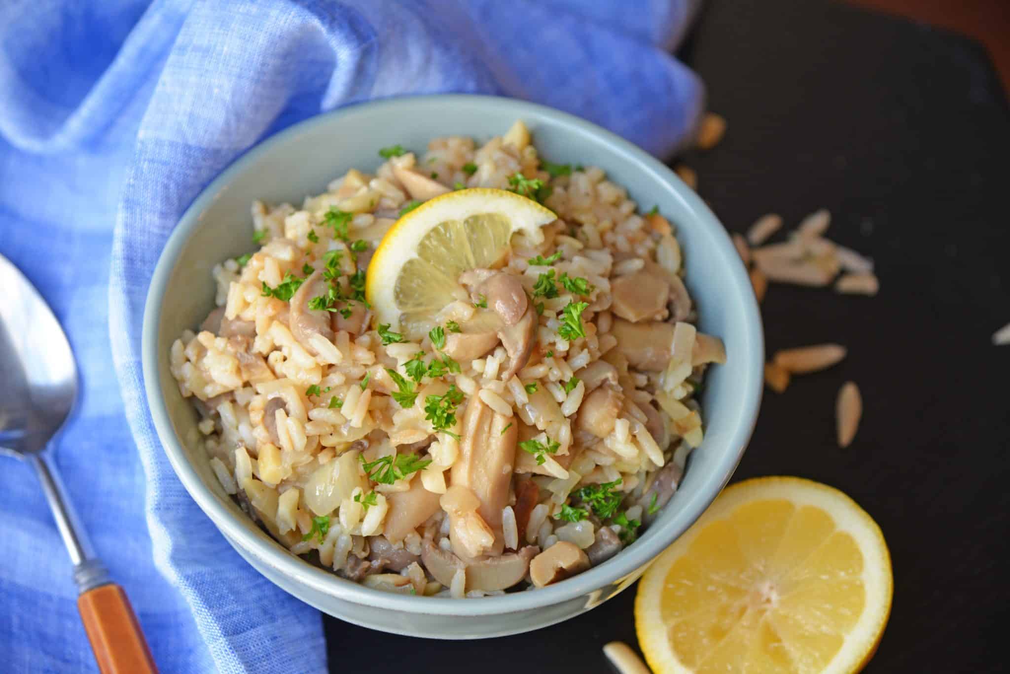 Almond Rice Pilaf is an easy side dish made with crunchy almonds, mushrooms and savory chicken broth and lemon juice to give it loads of flavor! An easy rice recipe the whole family will love. #ricepilafrecipe #easysidedish www.savoryexperiments.com