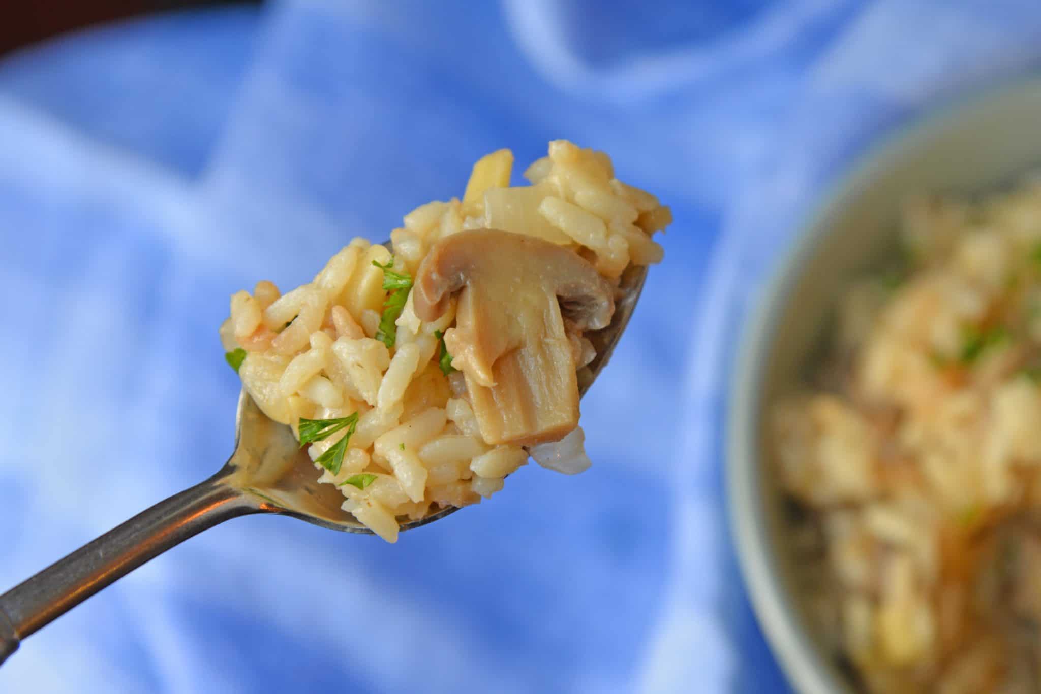 Almond Rice Pilaf is an easy side dish made with crunchy almonds, mushrooms and savory chicken broth and lemon juice to give it loads of flavor! An easy rice recipe the whole family will love. #ricepilafrecipe #easysidedish www.savoryexperiments.com 