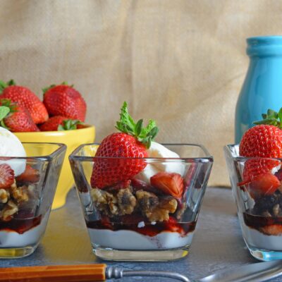 Balsamic Strawberry Parfait- Easy dessert recipe with layers of ice cream, yogurt-whipped cream mix, macerated strawberries and candied walnuts. Perfect for feeding a crowd or dinner parties! www.savoryexperiments.com