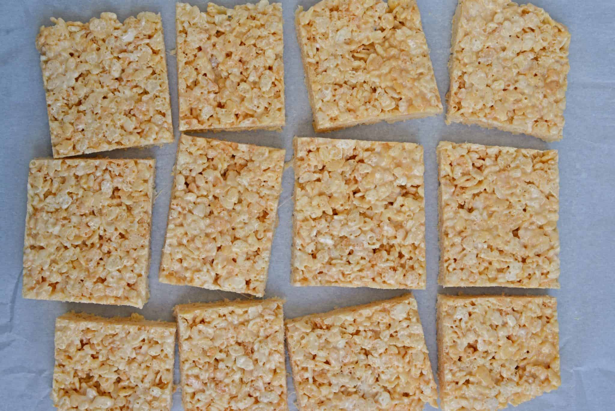 Caramel Rice Krispie Treats are a new twist on an old favorite! These homemade Rice Krispie Treats are so good and miles better then the store bought ones! #homemadericekrispietreats #carameldesserts www.savoryexperiments.com