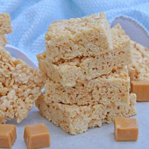 Caramel Rice Krispie Treats are a new twist on an old favorite! These homemade Rice Krispie Treats are so good and miles better then the store bought ones! #ricekrispietreats #ricekrispiebars www.savoryexperiments.com