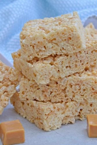Caramel Rice Krispie Treats are a new twist on an old favorite! These homemade Rice Krispie Treats are so good and miles better then the store bought ones! #ricekrispietreats #ricekrispiebars www.savoryexperiments.com