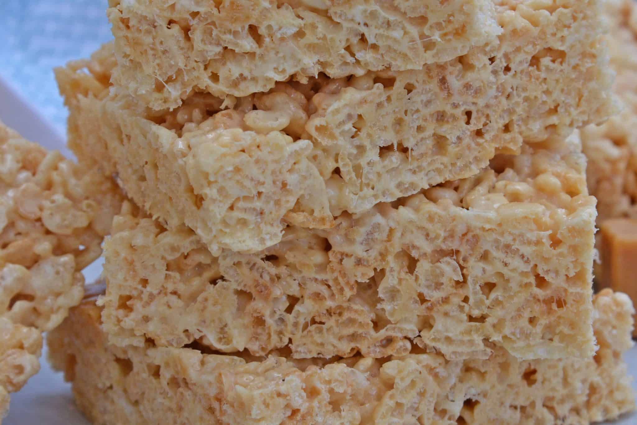 Caramel Rice Krispie Treats are a new twist on an old favorite! These homemade Rice Krispie Treats are so good and miles better then the store bought ones! #homemadericekrispietreats #carameldesserts www.savoryexperiments.com