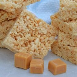 Caramel Rice Krispie Treats are a new twist on an old favorite! These homemade Rice Krispie Treats are so good and miles better then the store bought ones! #homemadericekrispietreats #carameldesserts www.savoryexperiments.com