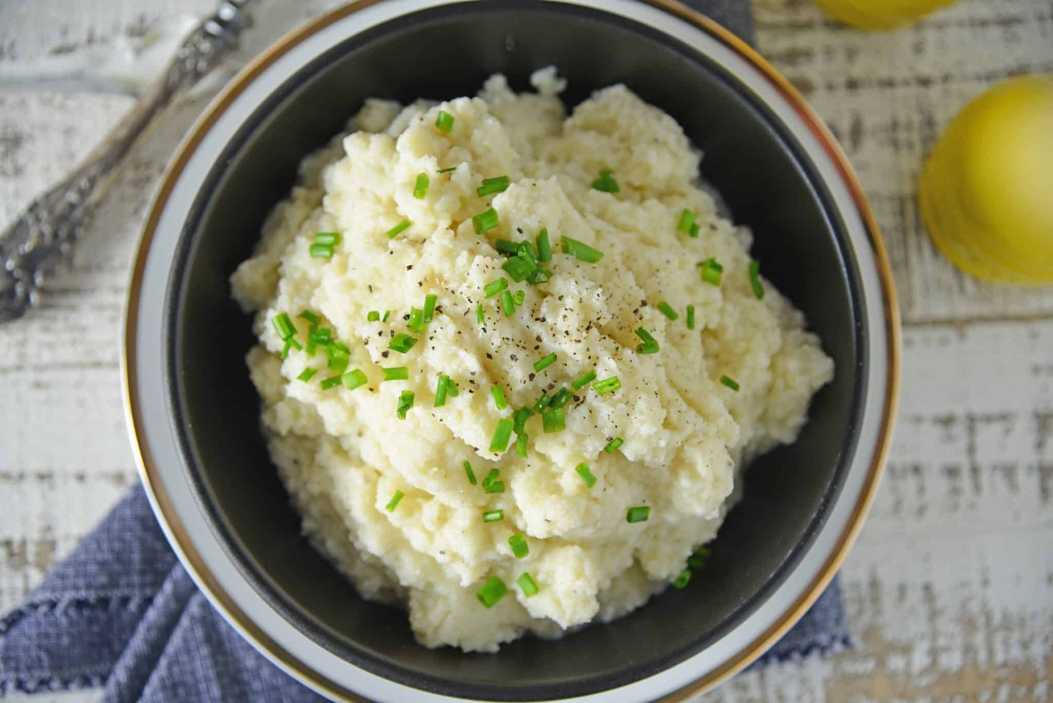 Mashed Cauliflower is a healthier alternative to mashed potatoes, with fewer carbs! This Mashed Cauliflower recipe is perfectly smooth and creamy! #mashedcauliflower #cauliflowermashedpotatoes www.savoryexperiments.com