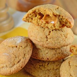 Caramel Apple Cookies are an easy, mess free way to enjoy a caramel apple! This fall cookie recipe is apple spiced cookie dough stuffed with gooey caramel! #applecookies #caramelapple #fallcookierecipe www.savoryexperiments.com