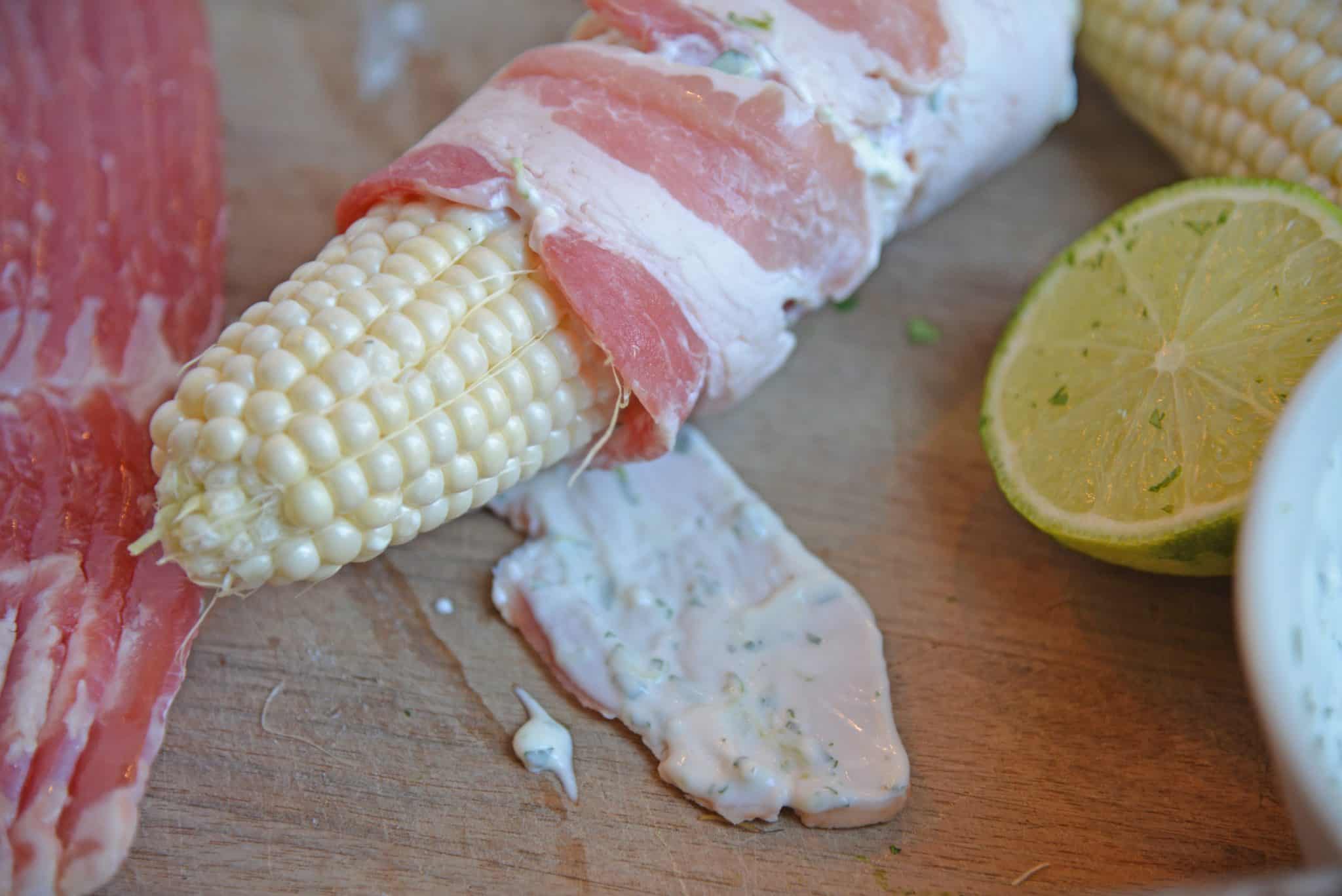 Cilantro Lime Bacon Wrapped Corn is a zesty grilled corn side dish that is perfect for any summer BBQ or Mexican fiesta! A sweet & zesty flavor combination! #grilledcorn #baconwrappedcorn #mexicancorn www.savoryexperiments.com
