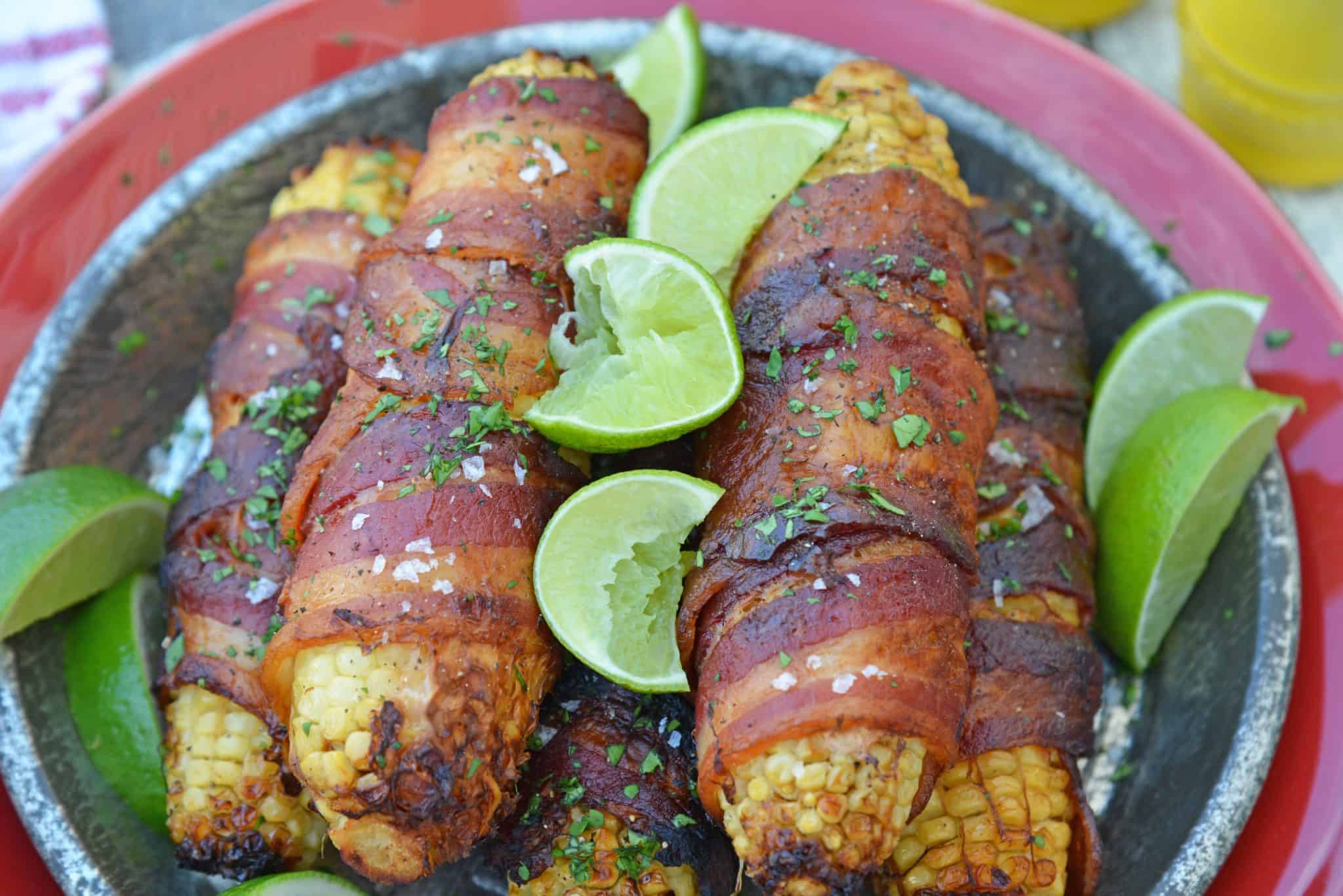 Cilantro Lime Bacon Wrapped Corn is a zesty grilled corn side dish that is perfect for any summer BBQ or Mexican fiesta! A sweet & zesty flavor combination! #grilledcorn #baconwrappedcorn #mexicancorn www.savoryexperiments.com