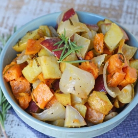 Garlic Roasted Potatoes with Rosemary are a mix of sweet and Yukon gold potatoes baked to a golden brown with olive oil, fresh rosemary, garlic and sweet onion! #ovenroastedpotatoes #garlicroastedpotatoes #potatorecipes www.savoryexperiments.com
