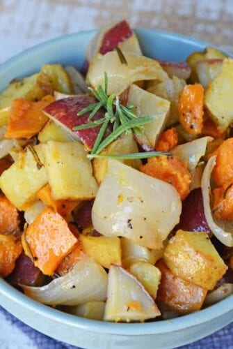 Garlic Roasted Potatoes with Rosemary are a mix of sweet and Yukon gold potatoes baked to a golden brown with olive oil, fresh rosemary, garlic and sweet onion! #ovenroastedpotatoes #garlicroastedpotatoes #potatorecipes www.savoryexperiments.com