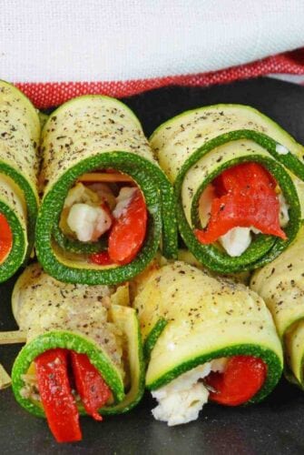 Zucchini Goat Cheese Rolls are tasty toothpick appetizers made with roasted red peppers, seasonings and creamy goat cheese. Make them ahead for an easy appetizer!