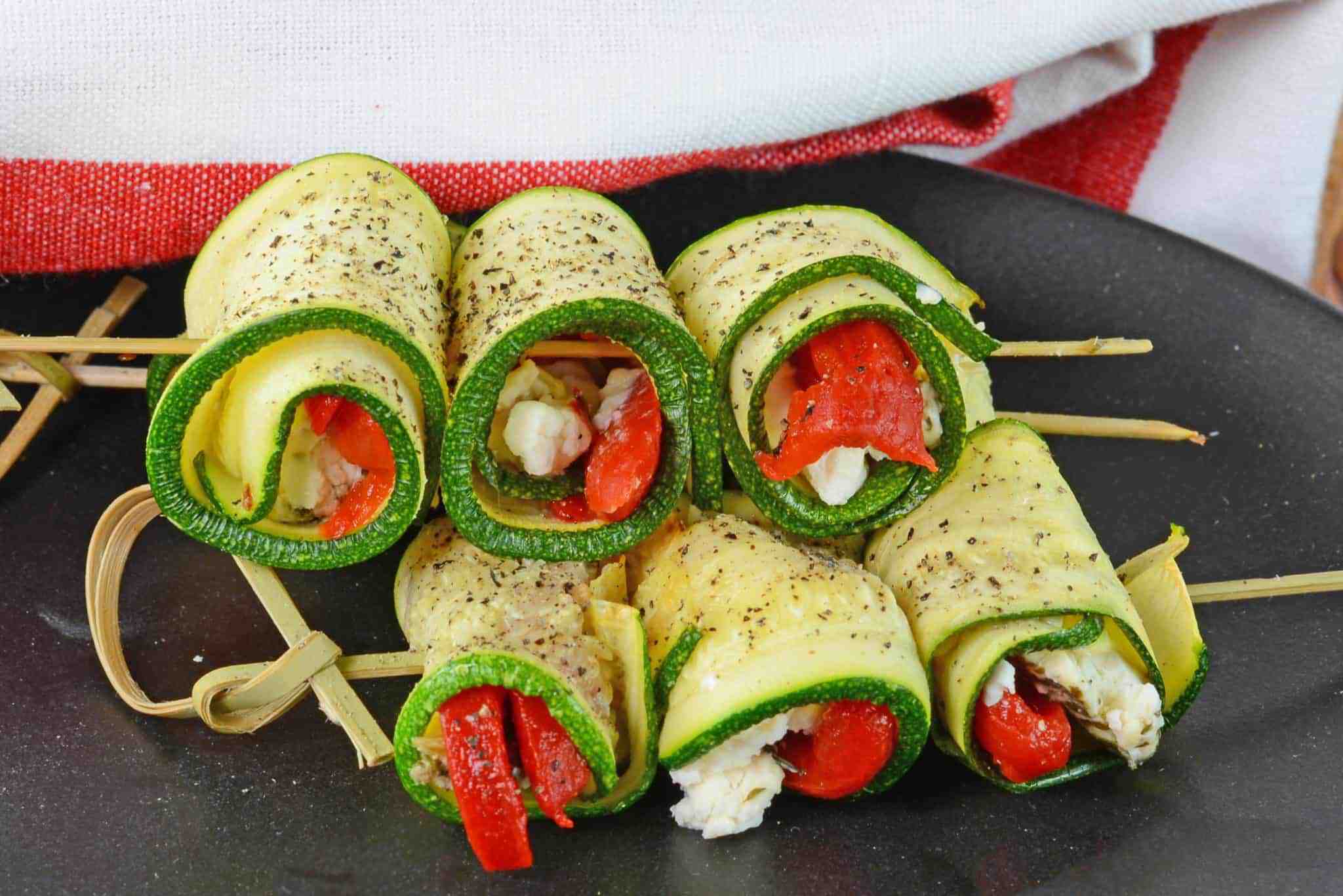 Zucchini Goat Cheese Rolls are tasty toothpick appetizers made with roasted red peppers, seasonings and creamy goat cheese. Make them ahead for an easy appetizer!