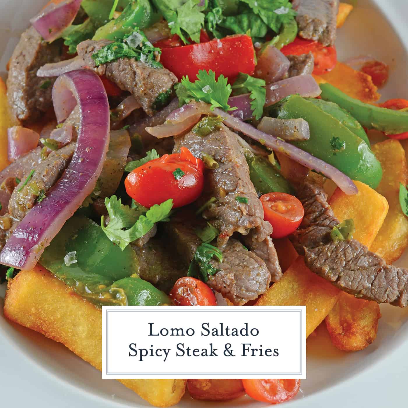 Lomo Saltado is a Peruvian dish using tender steak, onions, tomatoes, bell peppers and jalapenos over crispy French fries. #lomosaltado #steakandpotatoes www.savoryexperiments.com