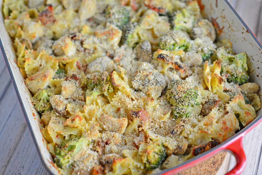 Cheesy Chicken Casserole is an easy casserole recipe perfect for feeding a large family on a budget. Chicken, cheese, pasta and vegetables- delicious! #easycasserolerecipes #bestchickenrecipes www.savoryexperiments.com