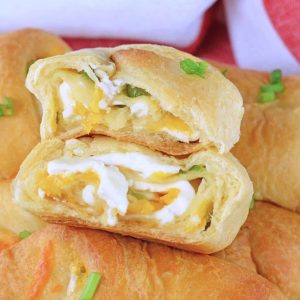 close up of jalapeno popper crescent roll cut in half