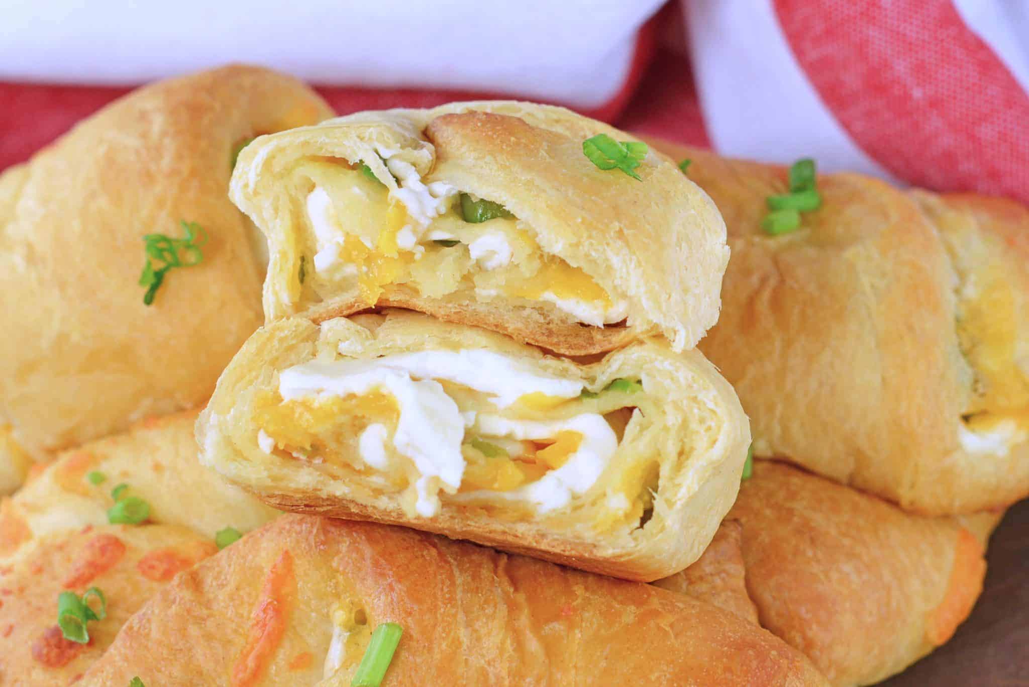 close up of jalapeno popper crescent roll cut in half