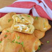 This Jalapeno Popper Crescent Rolls recipe is filled with cream cheese, jalapenos, and cheddar cheese wrapped in a flaky croissant dough. #crescentrollrecipes #crescentrollappetizers www.savoryexperiments.com