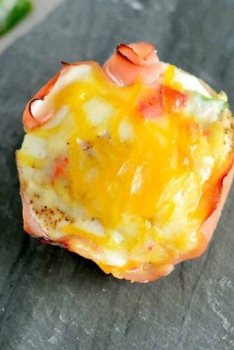 Get ready for these Western Egg Muffins to be your favorite type of Breakfast Eggs. Whether you are eating these baked egg cups at home or on the road, they are sure to be delicious! #bakedeggcups #breakfasteggs #eggmuffins www.savoryexperiments.com