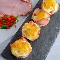 Get ready for these Western Egg Muffins to be your favorite type of Breakfast Eggs. Whether you are eating these baked egg cups at home or on the road, they are sure to be delicious! #bakedeggcups #breakfasteggs #eggmuffins www.savoryexperiments.com