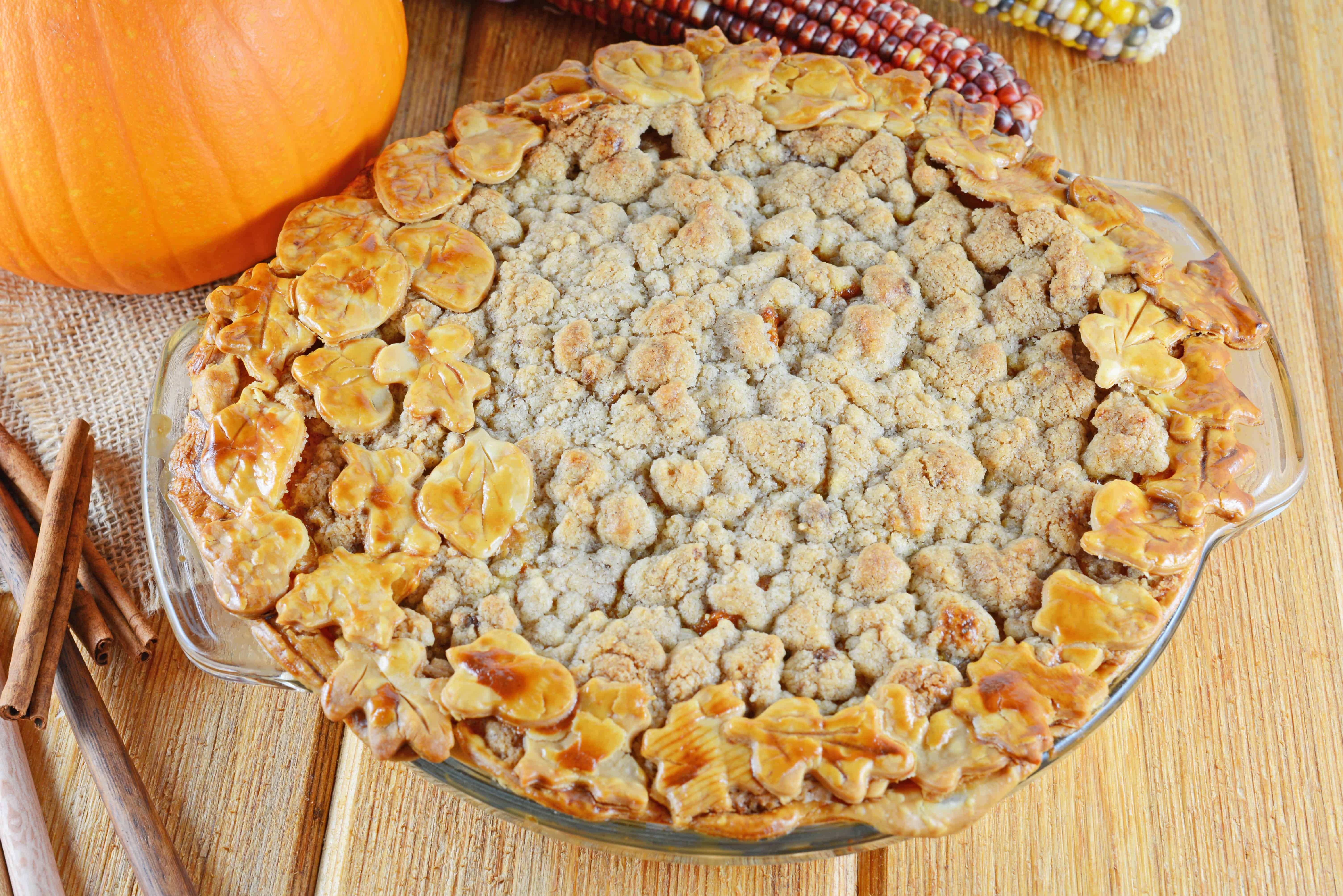 Pumpkin Apple Pie is the best of both worlds! Pumpkin pie and apple pie merged together in a pecan crust with streusel topping.