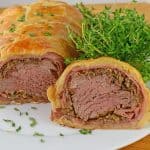 Beef Wellington a classic dish for a special occasion. Tender beef tenderloin is smothered in Dijon mustard, mushroom, shallot and proscuitto before being baked in a delicate puff pastry.