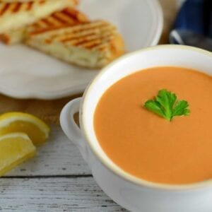 Creamy Tomato Soup - Rich and creamy, full of flavor from roasted onions, tomatoes and garlic! Make-ahead and freezer friendly!