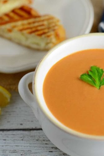 Creamy Tomato Soup - Rich and creamy, full of flavor from roasted onions, tomatoes and garlic! Make-ahead and freezer friendly!