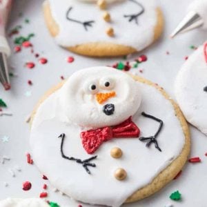 Super easy and fun to decorate, Melted Snowman Cookies are great for a children's project on a cold winter day. The cutest Christmas cookies ever! #meltedsnowmancookies #meltingsnowmen #easychristmascookies www.savoryexperiments.com