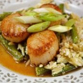 Orange Caramel Scallops are an easy recipe that brings the feel of the restaurant right to your home! Scallops covered in a sticky, sweet orange caramel sauce! #scallopsrecipe #seascallopsversusbayscallops www.savoryexperiments.com