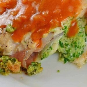 Gruyere and Prosciutto Stuffed Chicken is topped off with a silky tomato and shallot sauce. While this looks like a restaurant caliber meal, it only takes about 1 hour!